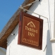 a hardwood panel with 24ct gold leaf lettering