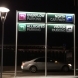 illuminated directional sign on posts