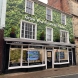 Shop front wrapped in printed graphics with raised cut acrylic lettering & window signage