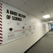 Printed vinyl wallpaper timeline with replaceable printed foamex panels & cut acrylic lettering